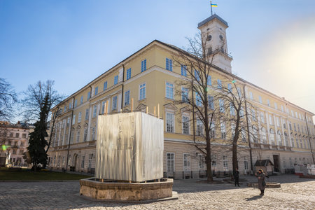 LVIV, UKRAINE - March 17, 2022: One of the statues near the City Hall in Lviv is shielded to prevent damaging during possible bombardment. Russia invaded Ukraine. War in Ukraineのeditorial素材
