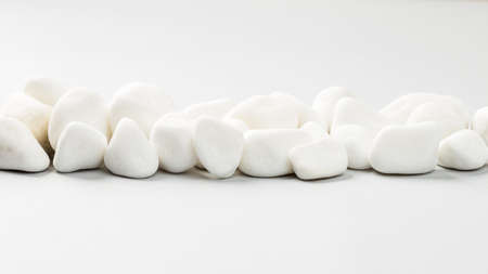 Wide banner with White rocks in a row on the grey background. Stone borderの写真素材