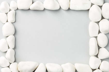 White stone frame on the grey background. Rock border