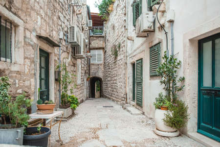 Narrow Alley in the Old Town of Dubrovnik with greenery in the pots. Inner mediterranean style yardの写真素材