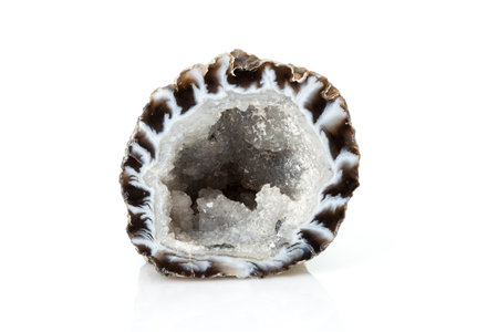Hyaline Quartz with Agate Geode Isolated on White Background. A Cross Section of Pure, clear or colorless quartz Formed within Volcanic Rockの写真素材