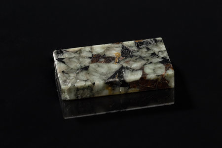 Labradorite Mineral Stone Slab Sample on the Reflecting Black Backgroundの写真素材