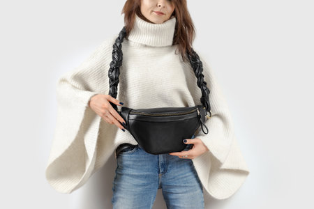 Woman Showing Black Genuine Leather Fanny Pack with Beautful Braided Strap. Handmade Leather Accessories Goodsの写真素材
