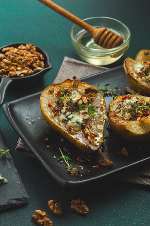 Baked Pears with Blue Cheese, Walnuts, Honey and Thyme. Healthy French Cuisine Appetiserの写真素材