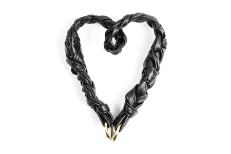 Black Genuine Leather Handmade Braided Shoulder Bag Strap Forming a Heart Shape Isolated on White Background. Leather Goods Production St Valentines Day Advertising Conceptの写真素材
