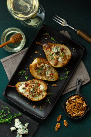 Baked Pears with Blue Cheese, Walnuts, Honey and Thyme. Served with a Glass of White Wine. Healthy Keto Diet Appetizerの写真素材