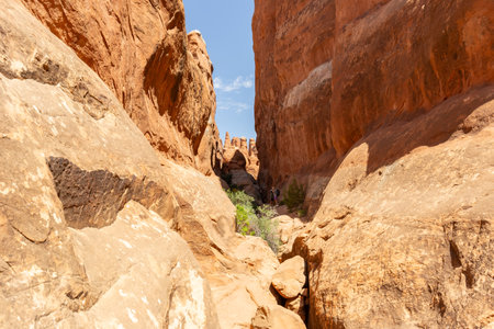 Narrow Sandstone Desert Rock Canyon with Steep Walls in Fiery Furnace Hiking Trail, Arches National Park, Utah, United Statesの写真素材