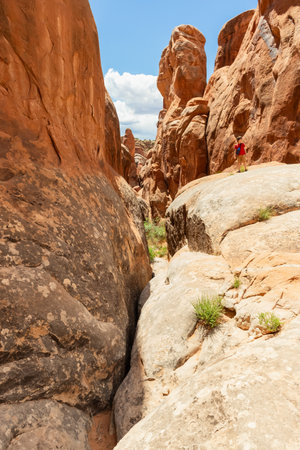 Narrow Sandstone Desert Rock Canyon with Steep Walls in Fiery Furnace Hiking Trail, Arches National Park, Utah, United Statesの写真素材