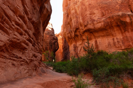 Two large rocks face each other to create a slot canyon inside the Fiery Furnace in Arches National Park near Moab, Utah.の写真素材