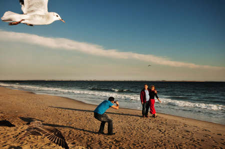 Men. Woman. Seagull.の写真素材