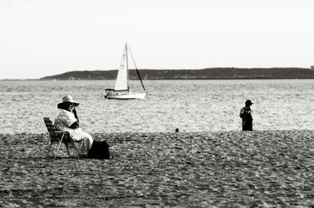 woman, sailing ship, beach.の写真素材