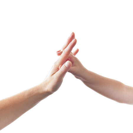 Child touching hand of mother isolated on white Background
