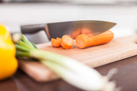 A kitchen knife with vegetablesの写真素材