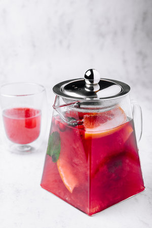 Strawberry, orange and basil sparkling punch, spring cocktailの写真素材
