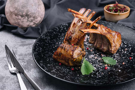 Beautifully grilled lamb rib chop steaks on plateの写真素材