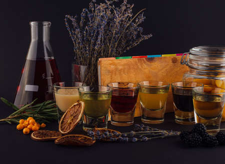 Multicolored transparent cocktails, a set of shots in one rowの写真素材