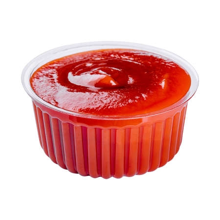 ketchup in a plastic bowl isolated on whiteの写真素材