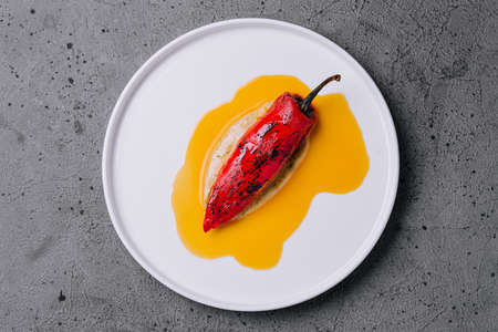 grilled peppers on a white plateの写真素材