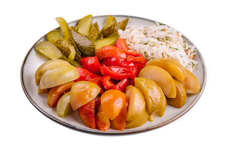 mixed pickles on a white plateの写真素材