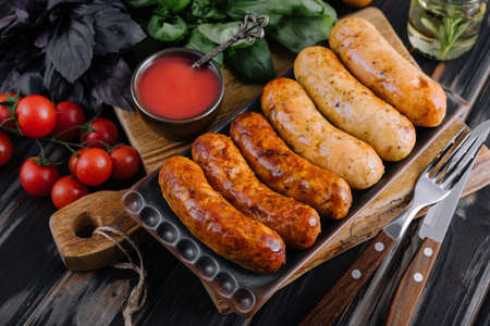Grilled sausages and vegetables close upの写真素材