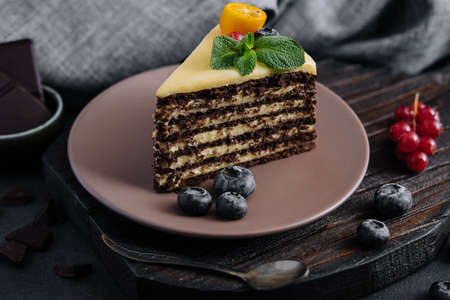 chocolate vanilla cake with berries on plateの写真素材