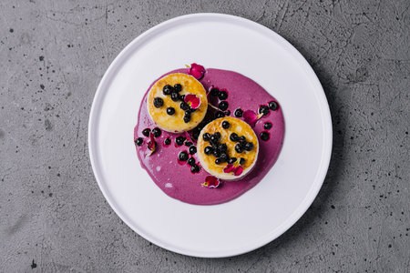Cottage cheese pancakes with currant syrupの写真素材