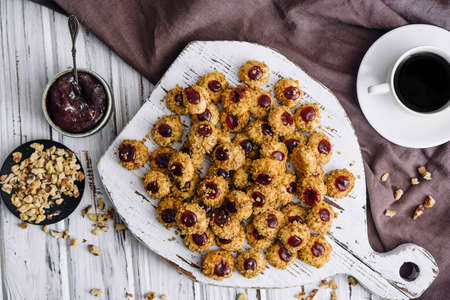 Fresh baked almond cookies with cup of coffeeの写真素材