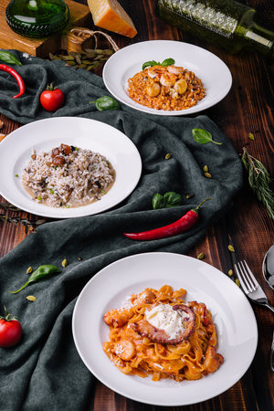 A set of seafood dishes. Pasta, bulgur, rice, couscous.の写真素材