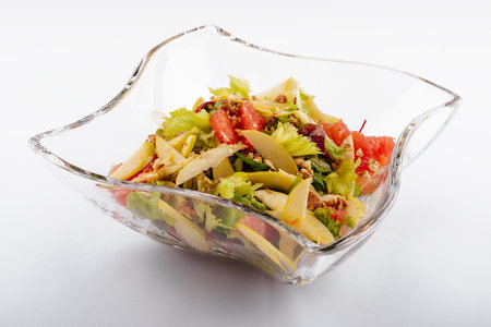 Plate with tasty grapefruit salad on white backgroundの写真素材