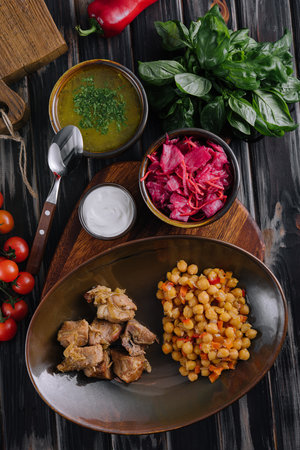 meat with chickpeas and soup - business lunchの写真素材