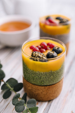 Mango turmeric chia pudding with berry fruitの写真素材