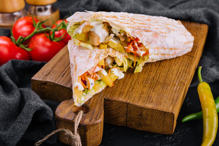 Delicious chicken shawarma on wooden boardの写真素材