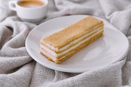 Napoleon cake slices with cup of coffeeの写真素材