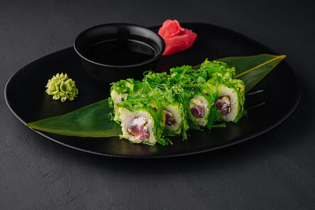 Sushi plate on black stone. japanese food.の写真素材
