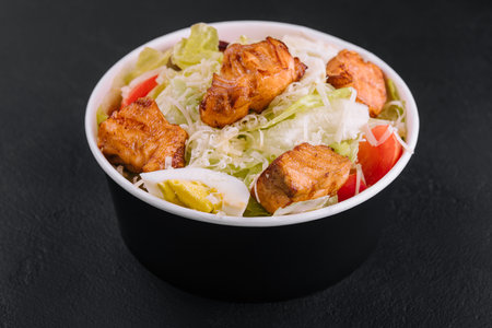 Caesar salad with chicken fillet and parmesan cheeseの写真素材