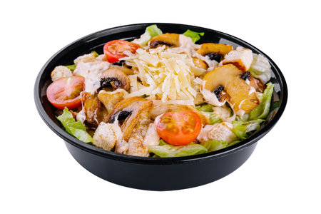 Warm salad with roasted chicken meat, vegetables and mushroomsの写真素材