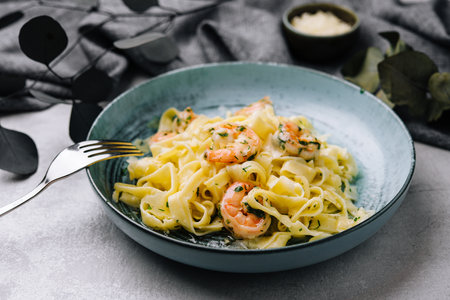 Italian pasta fettuccine or tagliatelle with shrimpsの写真素材