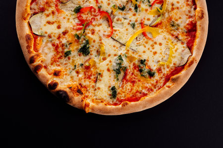 italian vegetarian pizza on black backgroundの写真素材