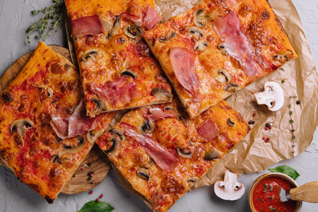 Long pizza mix lies on a wooden tableの写真素材