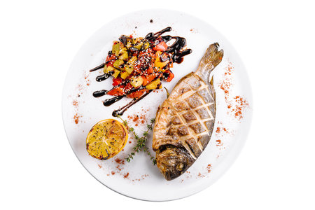 Grilled dorado fish with baked vegetables