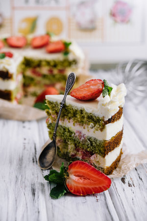 Green pistachio cake with strawberries closeupの写真素材