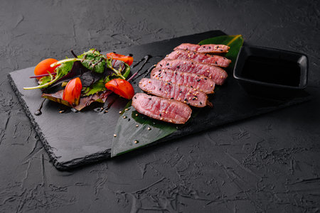 Sliced medium rare roasted beef meat piecesの写真素材