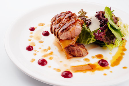 Slices of grilled duck breast fillet with saladの写真素材