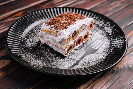 slice forest cake on black plateの写真素材