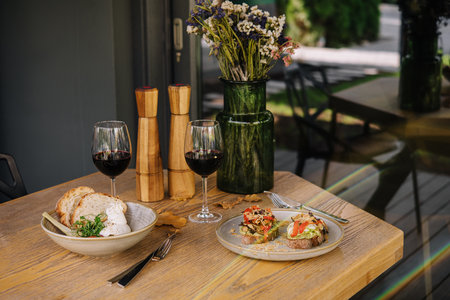 Italian salad with Burrata cheese and tomatoes and bruschetta with pesto sauce