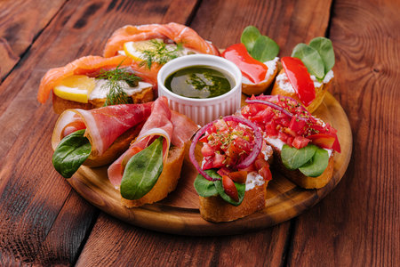 Different bruschetta on a wooden board