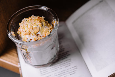 ice cream scoop with almonds and bookの写真素材