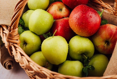 Close up of red and green apples with water dropsの写真素材