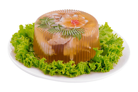Cold appetizer, portioned jelly of pork, beef and chicken on plateの写真素材