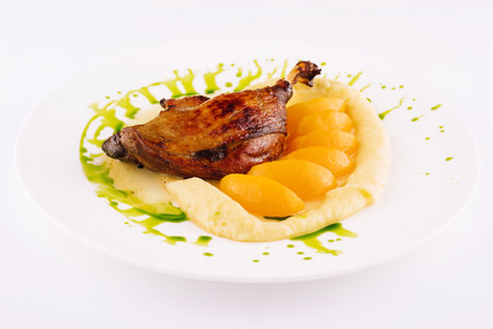duck leg confit with mashed potatoesの写真素材
